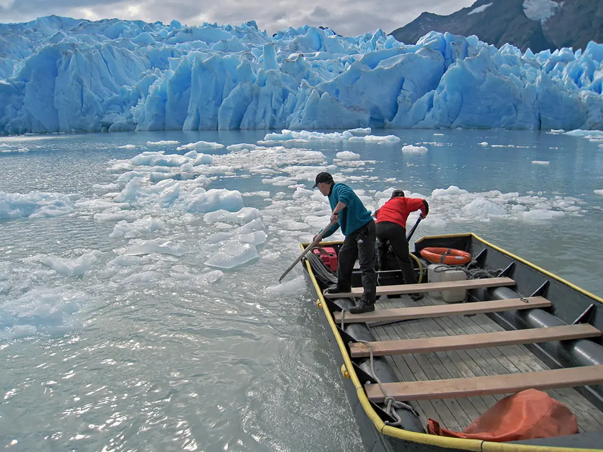 A small boat among the ice below Grey Glacier
